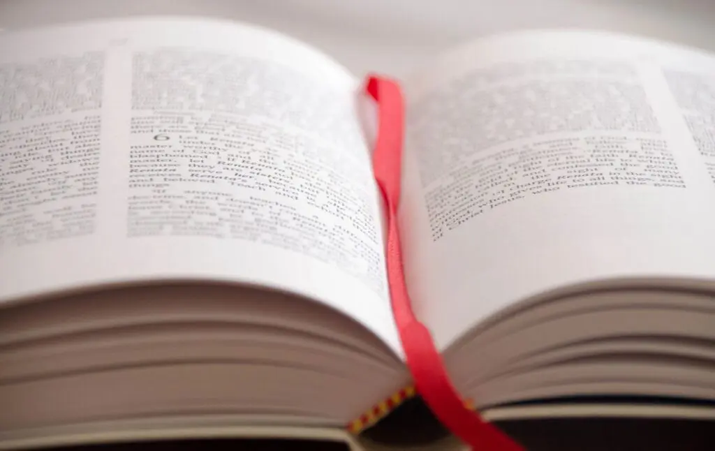 A book with a red bookmark on it